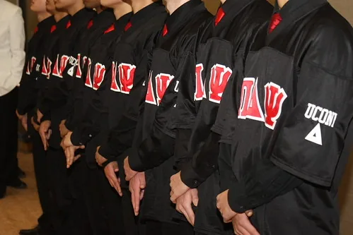 Brothers lined up wearing chapter letters